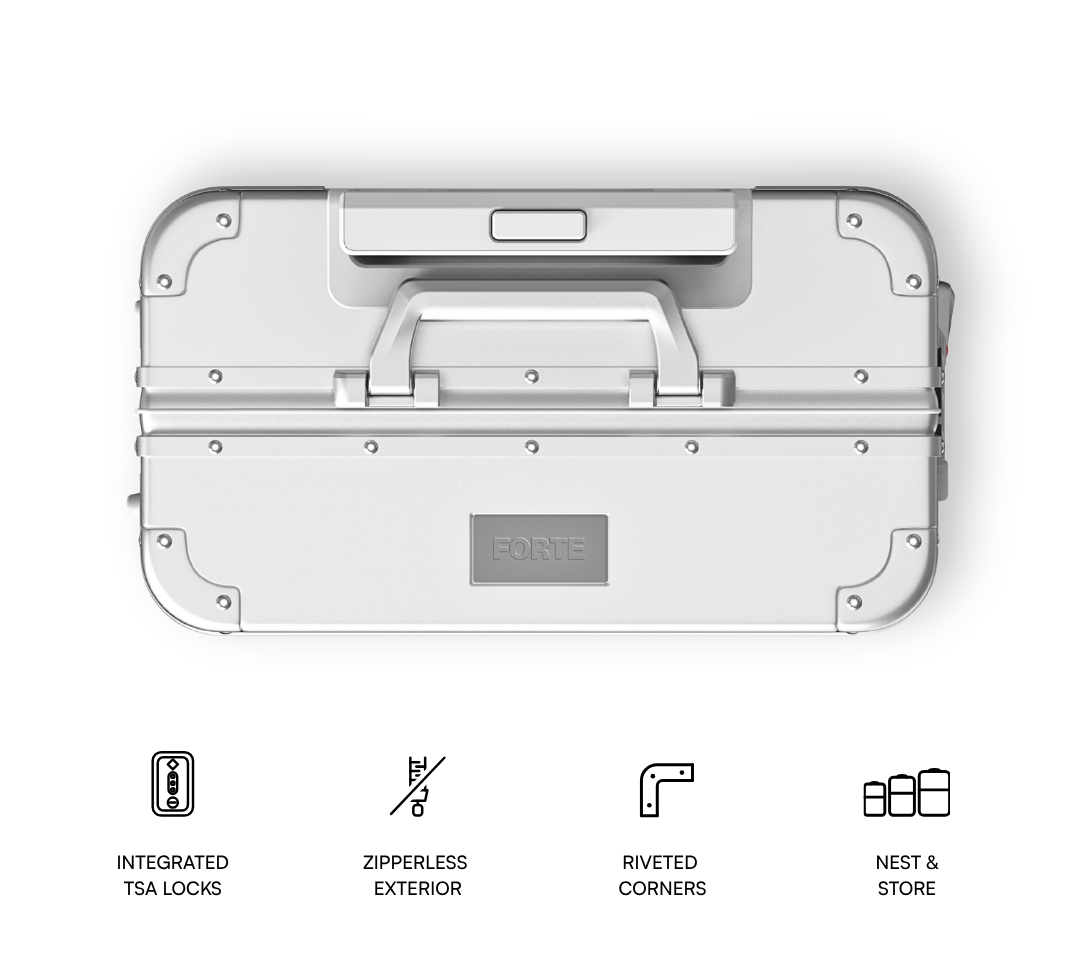A top-down view of a light gray aluminum hard case with a handle, corner protectors, and a central FORTE logo plate. Below the product are four black line icons and text describing features: integrated TSA locks, zipperless exterior, riveted corners, and nest & store.